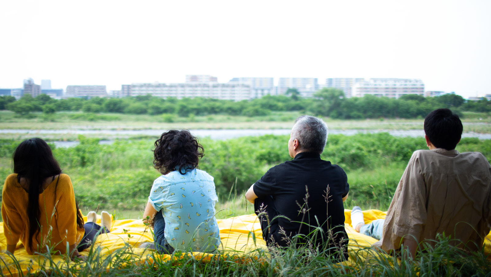 Koki Tanaka Abstracted | Family 2 Four People Sitting On A Field